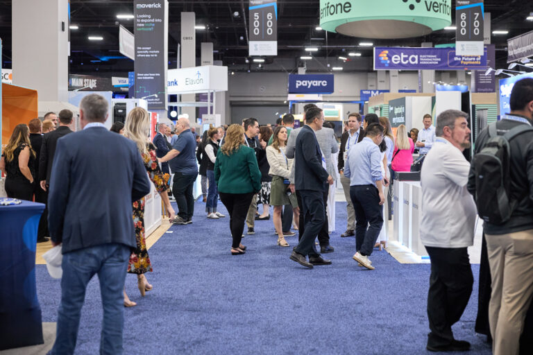 People walking the show floor at TRANSACT