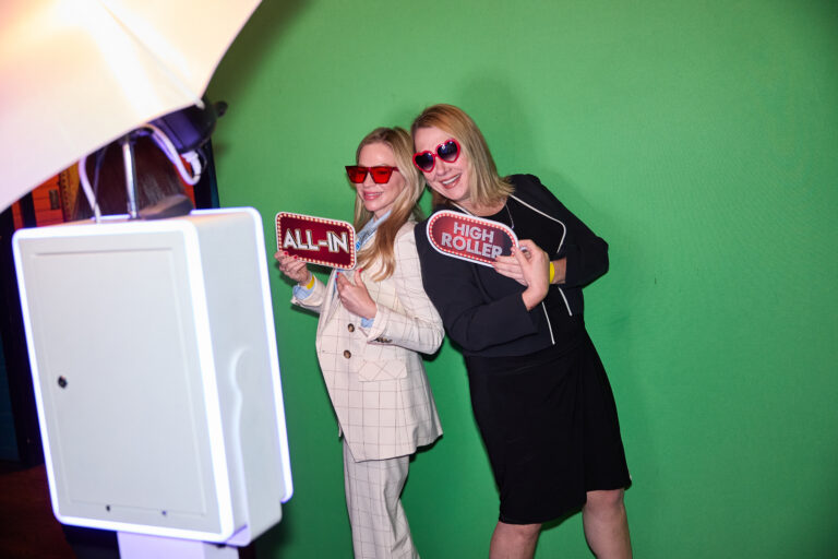 Attendees in the photobooth at TRANSACT