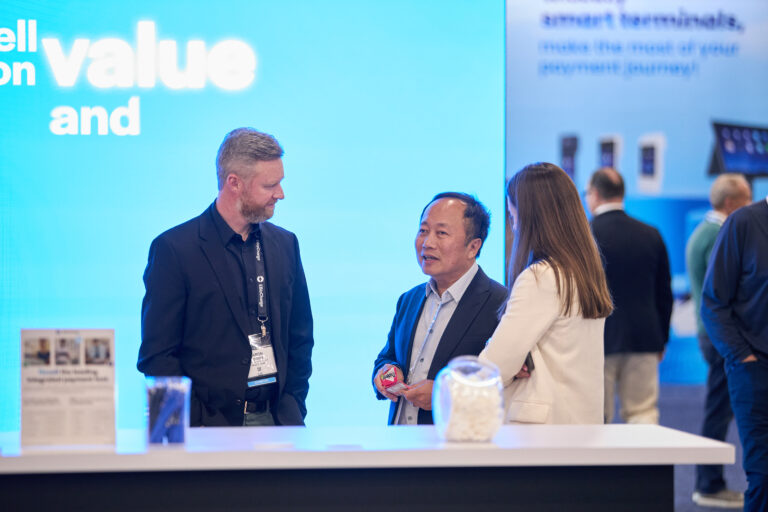 Attendees interacting with an Exhibitor