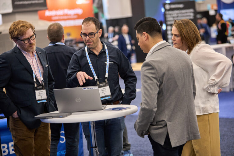 Attendees watching a product demonstration at TRANSACT