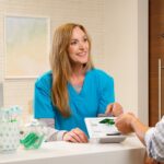 Nurse accepting a payment