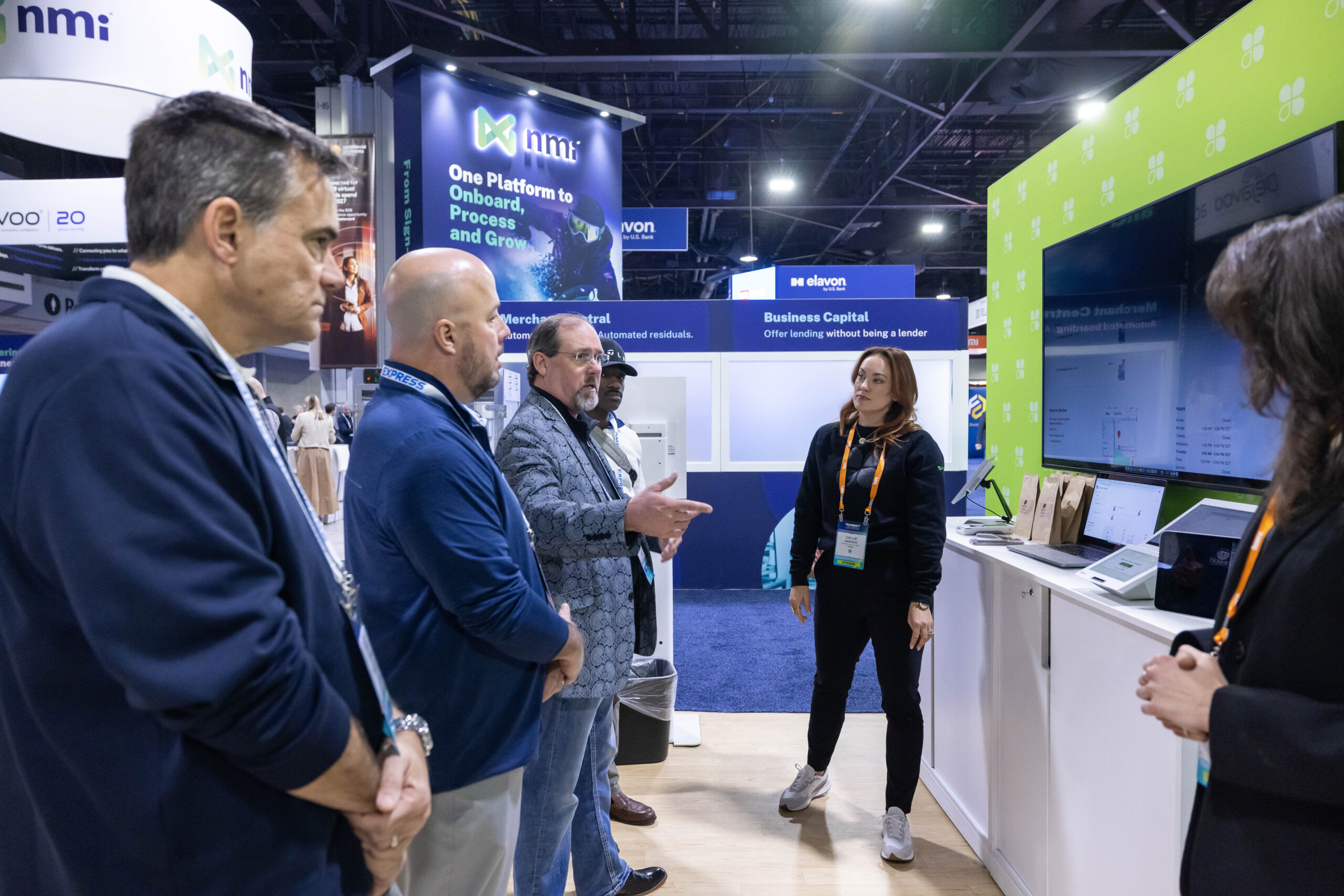 Exhibitor demonstrating something on a big screen
